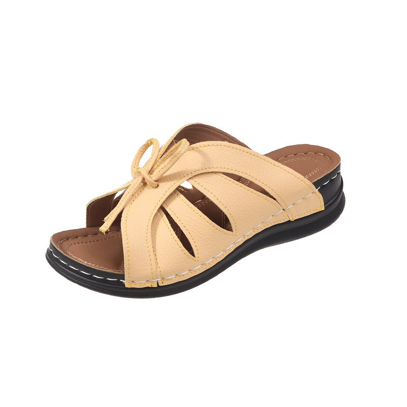 Hollow-out Bow Flat Wedge Slippers